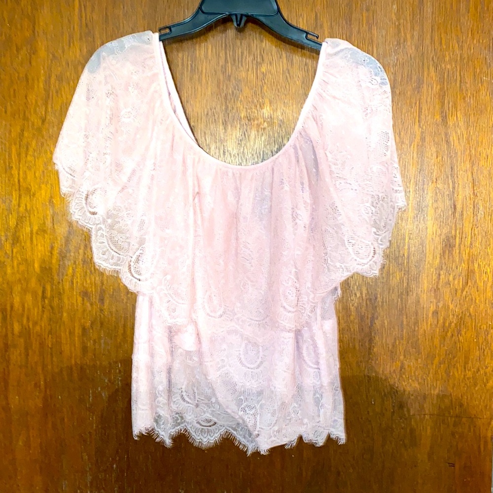 This super cute lace blouse. Never worn.